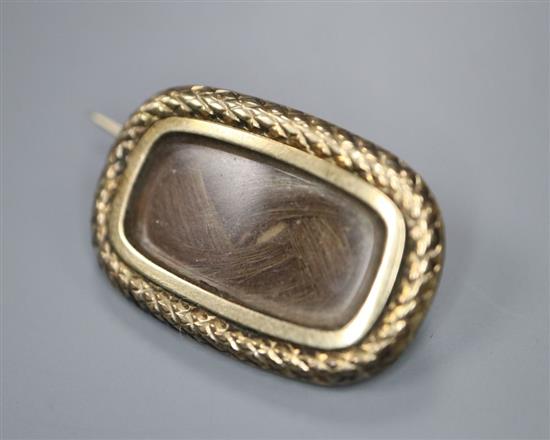 A Regency mourning brooch, a Victorian 9ct gold mourning ring, garnet ring and 15ct bar brooch.